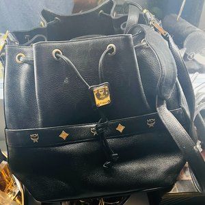 Large leather MCM bag with leather drawstring, carry strap and gold MCM accents